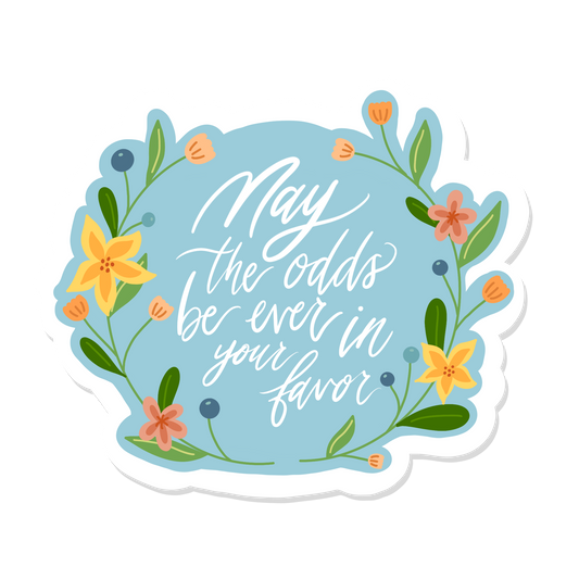 May the odds be ever in your favor sticker with flower drawing