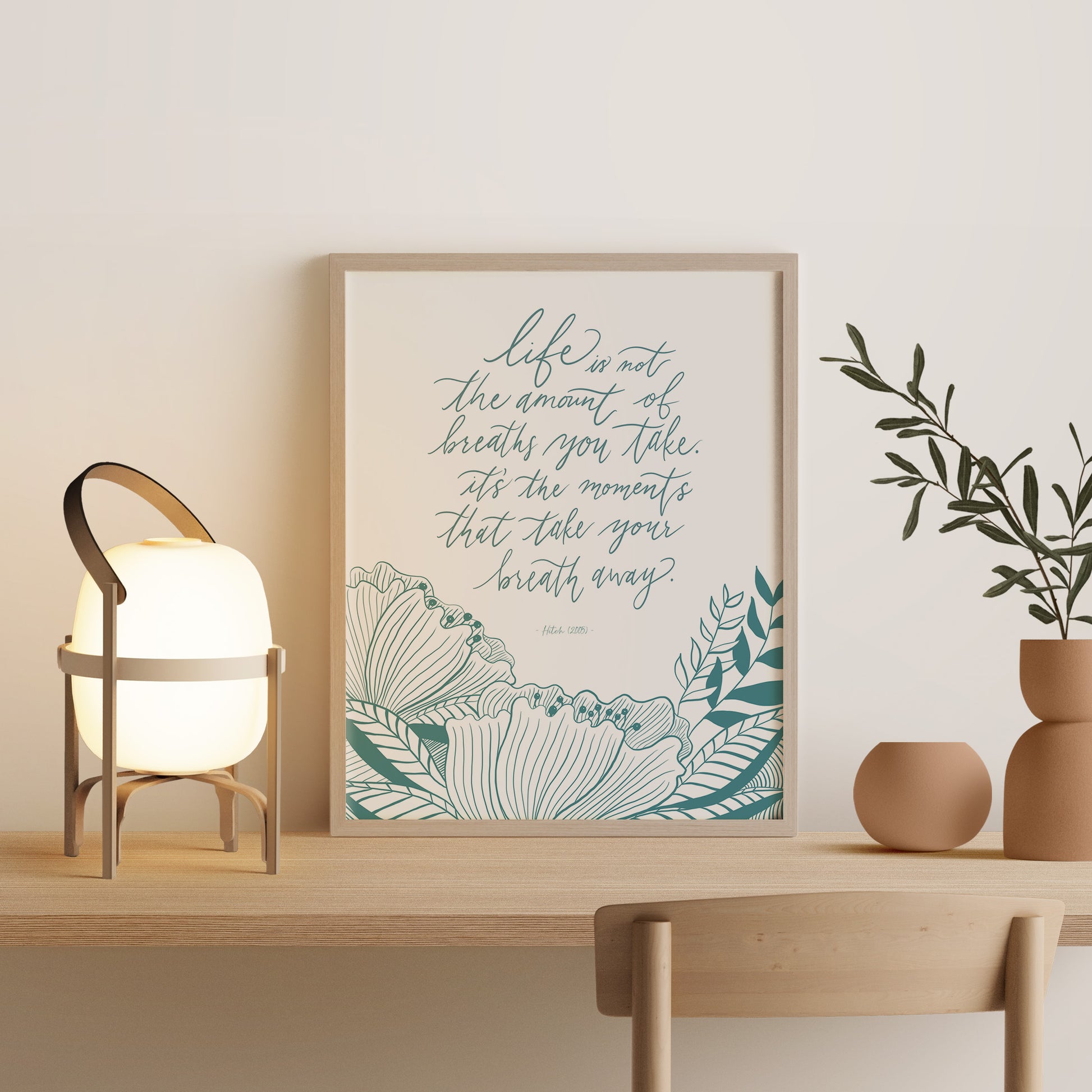 Framed art print of Hitch movie quote with blue floral drawing decor